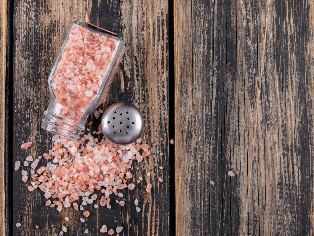 top-view-himalayan-salt-coming-out-open-salt-shaker